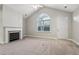 Bright living room with vaulted ceiling, fireplace, carpet flooring, and a large window at 2721 Grapevine Cir # 1701, Cumming, GA 30041