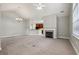 Spacious living room with fireplace and open view to the kitchen at 2721 Grapevine Cir # 1701, Cumming, GA 30041