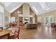 Community lounge area showcasing high ceilings, skylights, and a cozy fireplace at 2721 Grapevine Cir # 1701, Cumming, GA 30041