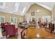 Community lounge area featuring high ceilings, skylights, and comfortable seating arrangements at 2721 Grapevine Cir # 1701, Cumming, GA 30041