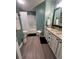 Well-appointed bathroom featuring dual sinks, granite counters, and a shower-tub combination at 4336 Thorngate Ln, Acworth, GA 30101