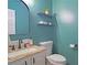 Well-lit half bathroom featuring a granite countertop and decorative mirror at 4336 Thorngate Ln, Acworth, GA 30101