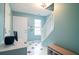 Charming entryway featuring tiled floors, a staircase with white banister, and abundant natural light at 4336 Thorngate Ln, Acworth, GA 30101