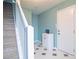 Inviting foyer features patterned tile, a white cabinet, and a staircase leading to the upper level at 4336 Thorngate Ln, Acworth, GA 30101