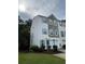 Charming townhouse featuring stone accents, well-maintained lawn, and mature landscaping at 4336 Thorngate Ln, Acworth, GA 30101