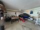 Well-lit garage with shelving and room for storage and a personal watercraft at 4336 Thorngate Ln, Acworth, GA 30101