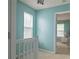 Upstairs hallway with natural light streaming through the window, showcasing access to a bedroom at 4336 Thorngate Ln, Acworth, GA 30101
