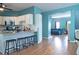 Open concept kitchen with breakfast bar seating, stainless appliances and view into the living room at 4336 Thorngate Ln, Acworth, GA 30101