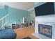 Spacious living room featuring a fireplace, aqua walls and an entertainment center at 4336 Thorngate Ln, Acworth, GA 30101