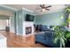 Bright living room with a fireplace, blue sofa and view into the kitchen at 4336 Thorngate Ln, Acworth, GA 30101