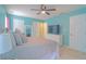 Spacious main bedroom with a ceiling fan, plentiful natural light, and ample closet space at 4336 Thorngate Ln, Acworth, GA 30101