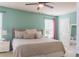 Serene main bedroom showcasing a plush bed with soft bedding and a ceiling fan at 4336 Thorngate Ln, Acworth, GA 30101