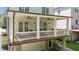 Spacious covered back porch with ceiling fans, offering ample seating and backyard views at 5971 Brundage Lane, Norcross, GA 30071