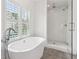The primary bathroom features a stand alone tub and walk-in shower at 5971 Brundage Lane, Norcross, GA 30071
