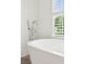 Primary bathroom features a stand alone tub and chrome faucet at 5971 Brundage Lane, Norcross, GA 30071