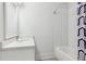 Bright bathroom features a white vanity, subway tile shower, and neutral decor at 5971 Brundage Lane, Norcross, GA 30071