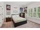 Cozy bedroom featuring a bed with black frame and posters on the walls at 5971 Brundage Lane, Norcross, GA 30071