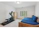 Bedroom featuring exercise equipment, a comfortable bed, and natural light at 5971 Brundage Lane, Norcross, GA 30071
