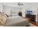 Large primary bedroom with hardwood floors and a king size bed at 5971 Brundage Lane, Norcross, GA 30071