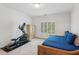 Bedroom has an elliptical machine for exercise at 5971 Brundage Lane, Norcross, GA 30071
