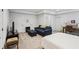 Spacious bedroom featuring a sofa, desk and a bed at 5971 Brundage Lane, Norcross, GA 30071