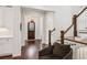 Inviting entryway featuring beautiful hardwood floors, staircase, and view to the front door at 5971 Brundage Lane, Norcross, GA 30071