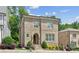 Charming two-story brick home with arched entry, manicured landscaping, and bright windows at 5971 Brundage Lane, Norcross, GA 30071