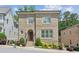 Charming two-story brick home with arched entry, manicured landscaping, and bright windows at 5971 Brundage Lane, Norcross, GA 30071