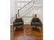 Foyer features wood flooring and two comfortable chairs at 5971 Brundage Lane, Norcross, GA 30071