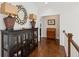 Charming hallway with hardwood floors and a wooden cabinet at 5971 Brundage Lane, Norcross, GA 30071