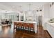 Spacious kitchen with white cabinets, stainless steel appliances, and large center island at 5971 Brundage Lane, Norcross, GA 30071