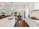 Kitchen island featuring white cabinets, marble countertops, and stainless steel appliances at 5971 Brundage Lane, Norcross, GA 30071