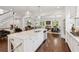 Bright, open kitchen with large center island, white cabinets, and hardwood floors at 5971 Brundage Lane, Norcross, GA 30071