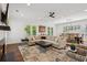 Open living space with hardwood floors, comfortable seating, and access to a dining area at 5971 Brundage Lane, Norcross, GA 30071