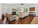 Bright living room features a fireplace, shuttered windows, hardwood floors, and stylish decor at 5971 Brundage Lane, Norcross, GA 30071