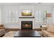 Bright living room with a fireplace, large windows, and hardwood floors at 5971 Brundage Lane, Norcross, GA 30071