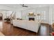 Comfortable living room with fireplace, hardwood floors, neutral colors, and shuttered windows at 5971 Brundage Lane, Norcross, GA 30071