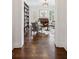 Inviting living room with hardwood floors, custom bookshelves, and an upright piano at 5971 Brundage Lane, Norcross, GA 30071