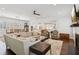 Spacious open living area with hardwood floors, fireplace, and seamlessly integrated kitchen and dining spaces at 5971 Brundage Lane, Norcross, GA 30071