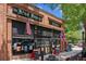 A brick restaurant with a large storefront with an American flag, and British flag in the windows at 5971 Brundage Lane, Norcross, GA 30071