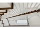 A modern staircase with white risers, dark wood treads, and open railing at 5971 Brundage Lane, Norcross, GA 30071