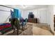 A bedroom with an open doorway, a bed with bedding, and disorganized personal items at 1151 Sheppard Pl, Stone Mountain, GA 30083