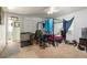 A bedroom with an open doorway, a bed with bedding, and disorganized personal items at 1151 Sheppard Pl, Stone Mountain, GA 30083