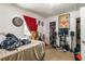 A bedroom with a window, a closet, decor, and disorganized personal items on a carpeted floor at 1151 Sheppard Pl, Stone Mountain, GA 30083