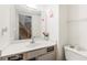 Bathroom featuring fresh paint, a mirror and neutral countertops at 1523 Dillard Rd, Stone Mountain, GA 30088