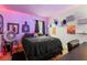 Bedroom featuring colorful decor, a comfortable bed and natural light at 1523 Dillard Rd, Stone Mountain, GA 30088