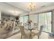 Elegant dining room with mirrored wall, glass table, and stylish chairs at 1523 Dillard Rd, Stone Mountain, GA 30088