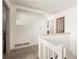 Upstairs hallway featuring fresh paint, carpet flooring and natural light at 1523 Dillard Rd, Stone Mountain, GA 30088