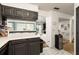 Open-concept living space featuring updated kitchen counters and open flow to a cozy living room at 1523 Dillard Rd, Stone Mountain, GA 30088