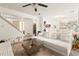 Bright living space with view of kitchen, dining room, open staircase, and plush furniture at 1523 Dillard Rd, Stone Mountain, GA 30088